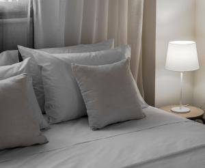 Postel nebo postele na pokoji v ubytování Aelia Apartments