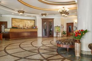 a lobby with a reception desk in a building at Hotel Garden Ring in Moscow