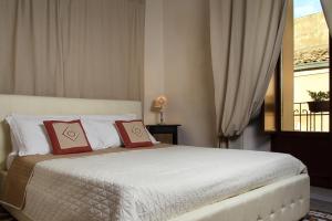 Posteľ alebo postele v izbe v ubytovaní Xenía B&B