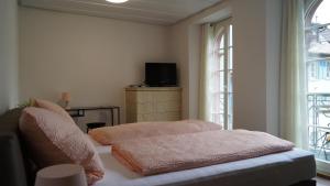 En eller flere senge i et værelse på Ferienwohnung im historischen Stadttor