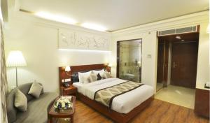 Postel nebo postele na pokoji v ubytování Hotel Regent Grand