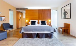 A bed or beds in a room at Hotel Condes de Barcelona