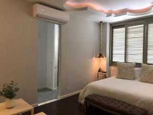 Postel nebo postele na pokoji v ubytování Hotel Monaguillo de Getsemaní