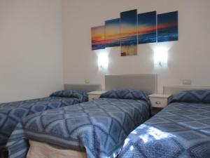 Posteľ alebo postele v izbe v ubytovaní Palinuro casa vacanze "Donna Antonia"