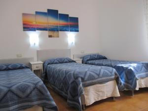 Posteľ alebo postele v izbe v ubytovaní Palinuro casa vacanze "Donna Antonia"