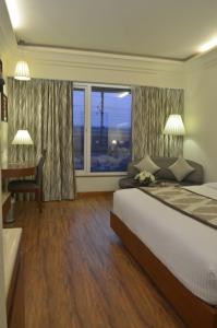 Postel nebo postele na pokoji v ubytování Hotel Regent Grand