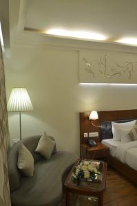 Postel nebo postele na pokoji v ubytování Hotel Regent Grand