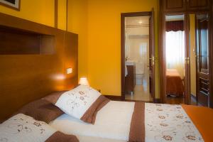 Cama o camas de una habitación en Pension ARCA