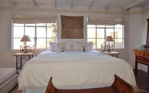 Ένα ή περισσότερα κρεβάτια σε δωμάτιο στο Suites Santo Domingo
