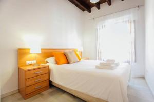 Säng eller sängar i ett rum på Precioso apartamento en el casco antiguo de Triana