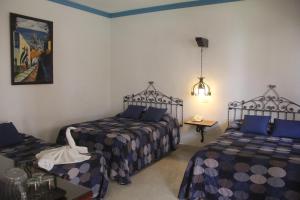 Postel nebo postele na pokoji v ubytování Hotel Zaci