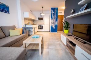 Kuchyňa alebo kuchynka v ubytovaní FUDA APARTAMENT BRUKSELSKA 11