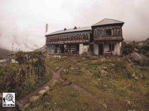 an old house on top of a mountain at NotOnMap - Adobe The Cloud in Chitkul