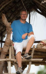 a man sitting on top of a tree at Wilpattu Dolosmahe in Wilpattu