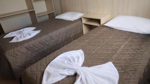 Postel nebo postele na pokoji v ubytování Hotel Ricardi Express