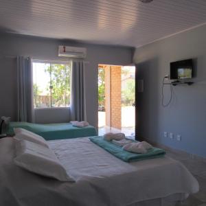 Кровать или кровати в номере Chacara Manaca da Serra