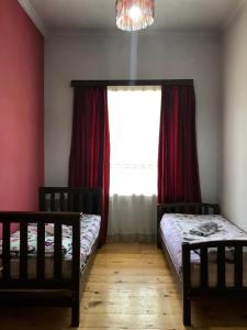 Postel nebo postele na pokoji v ubytování Mimino Guest House