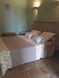 Postel nebo postele na pokoji v ubytování Hotel Font De Lauro