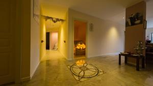 a hallway with a living room with a table at Il Parco Sul Mare Resort & SPA in Tortoreto Lido