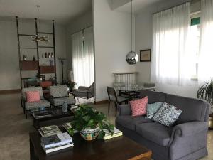 a living room with a couch and a table at B&B Questa casa non e'un albergo in Palermo