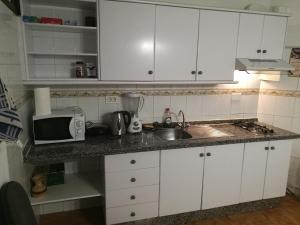 Кухня или кухненски бокс в Apartment Marina Primavera