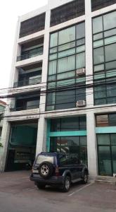 a black truck parked in front of a building at Airport Travelodge Manila in Manila