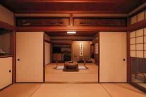 an entrance to a room with doors open at Jinpuso in Miyazu