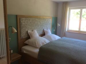Ένα ή περισσότερα κρεβάτια σε δωμάτιο στο Haus Seefrieden