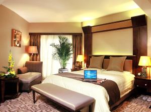 Postel nebo postele na pokoji v ubytování Xiyuan Hotel