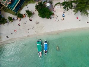 an overhead view of two boats on a beach at Mama Beach Residence - Adults Only in Phi Phi Islands