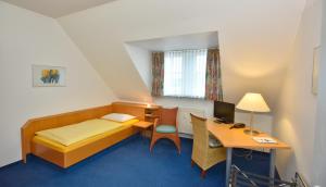 Postel nebo postele na pokoji v ubytování Hotel Fasanengarten