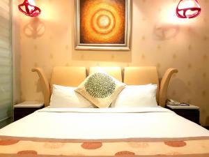 Letto o letti in una camera di Pal Heights Mantra
