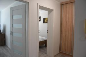 Posteľ alebo postele v izbe v ubytovaní Apartament w Śródmieściu