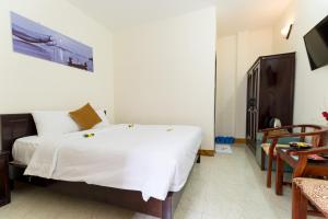 Postel nebo postele na pokoji v ubytování Hoa Thu Homestay