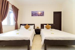 Postel nebo postele na pokoji v ubytování Hoa Thu Homestay