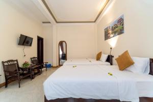 Postel nebo postele na pokoji v ubytování Hoa Thu Homestay