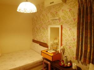 Letto o letti in una camera di Ku Shan Yuan Hotel