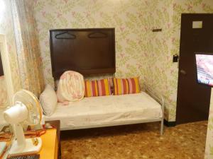Letto o letti in una camera di Ku Shan Yuan Hotel