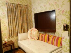 Letto o letti in una camera di Ku Shan Yuan Hotel