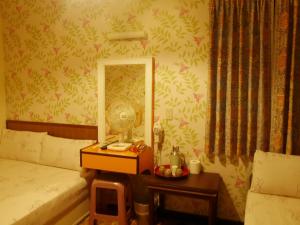 Letto o letti in una camera di Ku Shan Yuan Hotel