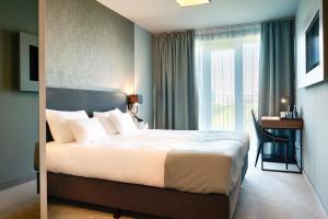 Posteľ alebo postele v izbe v ubytovaní Focus Hotel Poznań + 25 fotografií