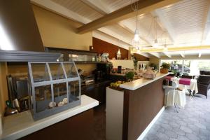 Kuchyň nebo kuchyňský kout v ubytování B&B Villa Dei Pini