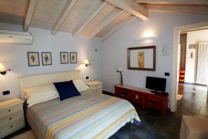 Postel nebo postele na pokoji v ubytování B&B Villa Dei Pini