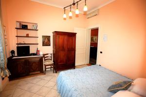 TV a/nebo společenská místnost v ubytování B&B Villa Dei Pini