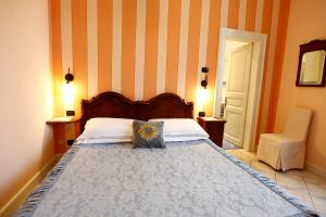 Postel nebo postele na pokoji v ubytování B&B Villa Dei Pini