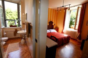 Postel nebo postele na pokoji v ubytování B&B Villa Dei Pini