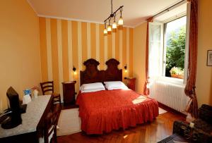 Postel nebo postele na pokoji v ubytování B&B Villa Dei Pini
