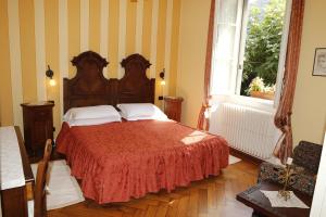Postel nebo postele na pokoji v ubytování B&B Villa Dei Pini