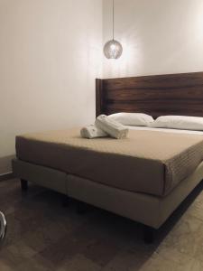 Postel nebo postele na pokoji v ubytování Albergo Milazzo Inn AiMori