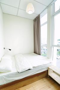 מיטה או מיטות בחדר ב-B@Home